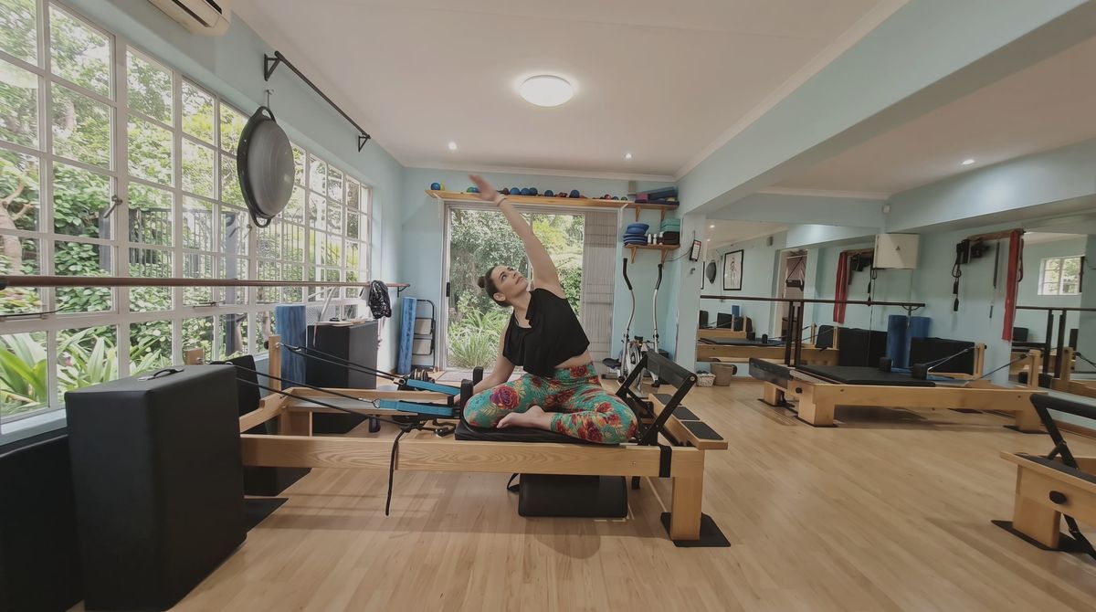 The Pilates Dynamics studio, with the garden through the windows